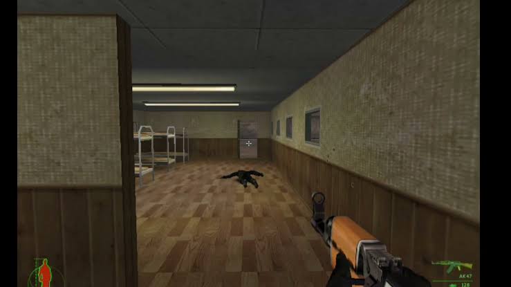 First-person view down an indoor barracks corridor with a fallen guard and a rifle in the foreground